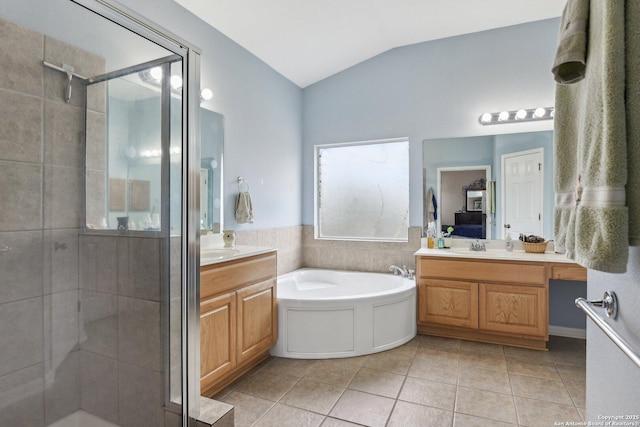 bathroom with lofted ceiling, tile patterned flooring, two vanities, a shower stall, and a bath