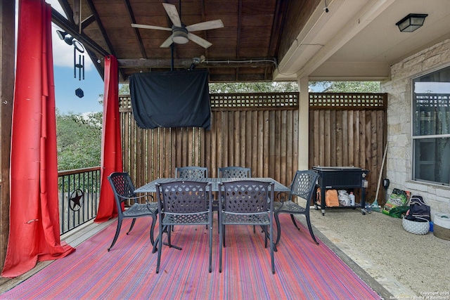 deck with fence, a ceiling fan, and outdoor dining space