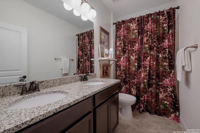 bathroom featuring double vanity, a sink, toilet, and a shower with curtain