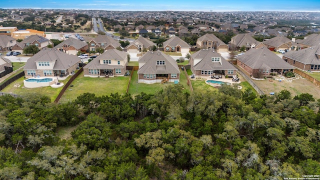 birds eye view of property with a residential view