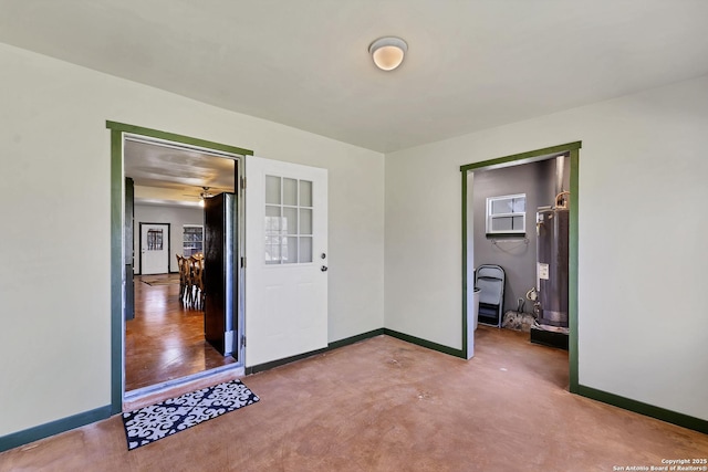 bedroom featuring water heater and baseboards