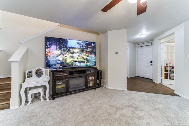 16110 Ambush Grv, San Antonio, TX 78247 - carpeted living room with stairway, a ceiling fan, and baseboards