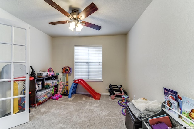 16110 Ambush Grv, San Antonio, TX 78247 - game room with a ceiling fan, carpet floors, and a textured ceiling