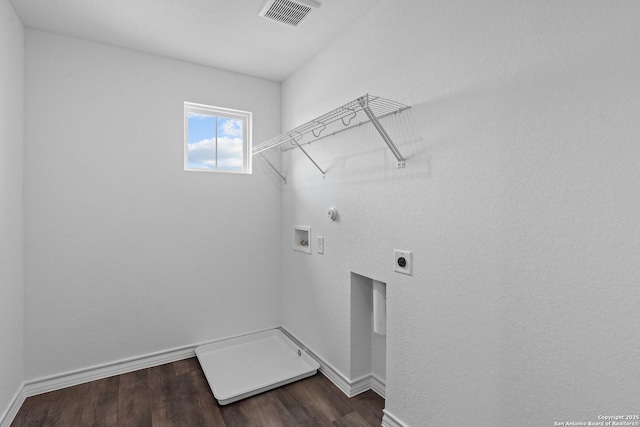 washroom featuring hookup for a washing machine, hookup for an electric dryer, laundry area, dark wood-style flooring, and visible vents