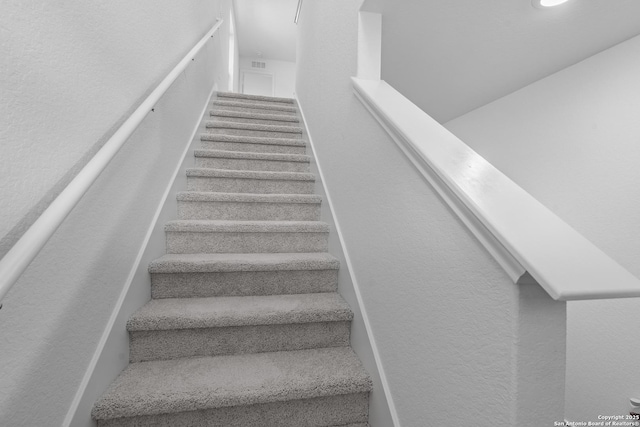 stairs with a textured wall