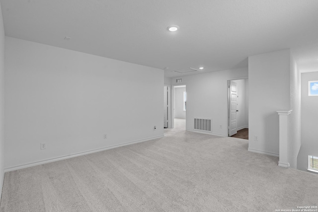 spare room featuring baseboards, visible vents, carpet flooring, and recessed lighting