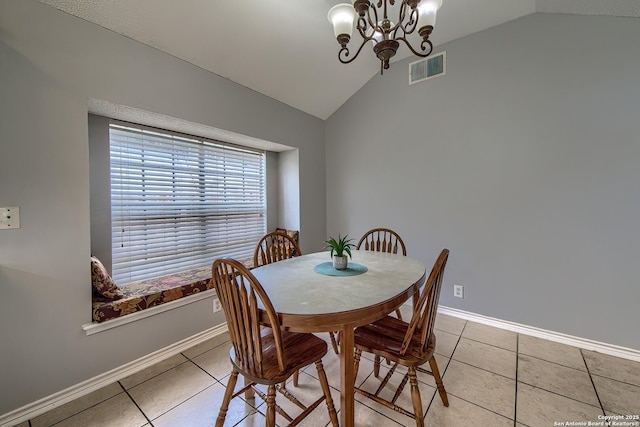 dining room with a chandelier, lofted ceiling, visible vents, and light tile patterned floors