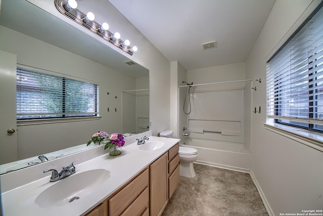 full bathroom featuring shower / bathtub combination, double vanity, a sink, and toilet