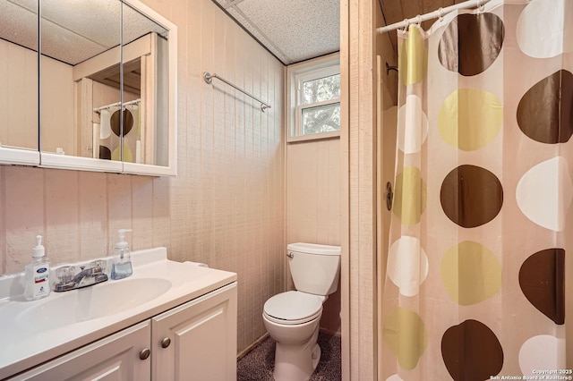 bathroom featuring a paneled ceiling, vanity, toilet, and a shower with curtain