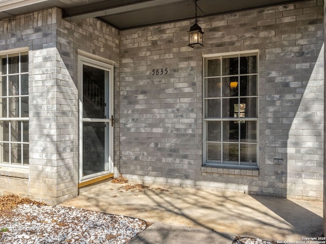 entrance to property with brick siding