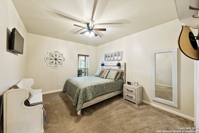 carpeted bedroom with a ceiling fan and baseboards