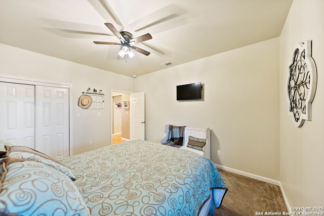 carpeted bedroom with baseboards, visible vents, ceiling fan, and a closet