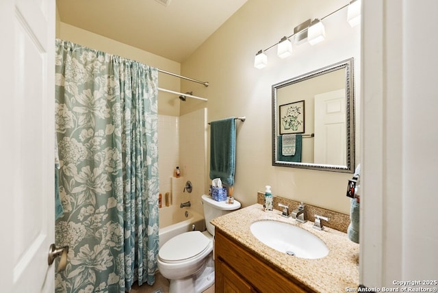 bathroom with shower / bath combo, vanity, and toilet