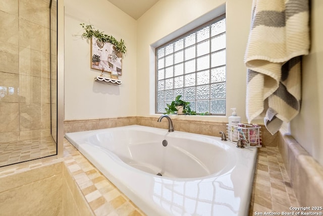 bathroom featuring a garden tub