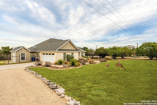 view of front of house with concrete driveway, an attached garage, and a front lawn