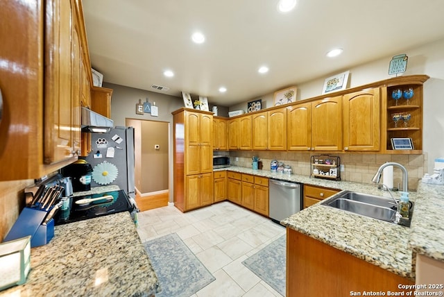 kitchen featuring decorative backsplash, brown cabinets, extractor fan, stainless steel appliances, and a sink