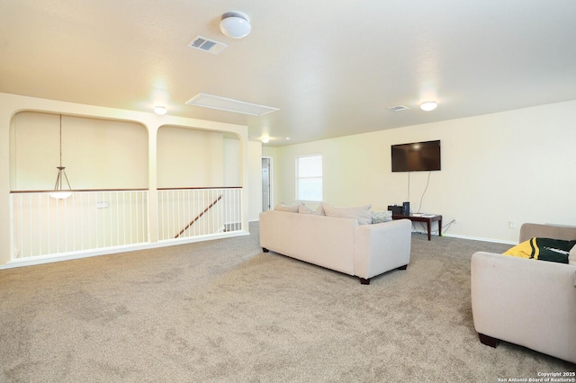 carpeted living area featuring visible vents