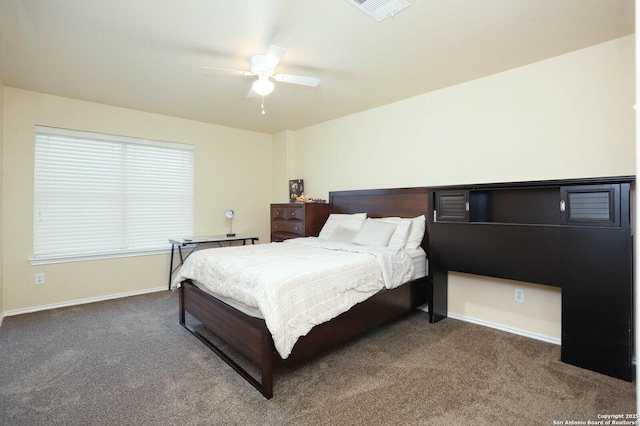 bedroom with a ceiling fan, carpet flooring, visible vents, and baseboards