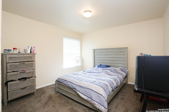 carpeted bedroom with baseboards