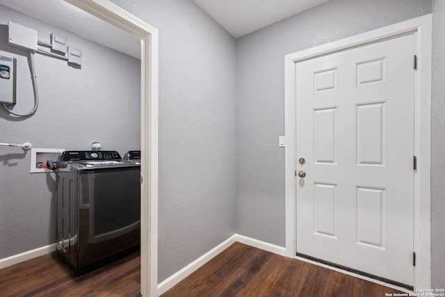doorway to outside featuring baseboards and dark wood-style floors