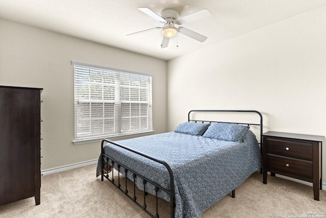 bedroom featuring carpet, baseboards, and ceiling fan