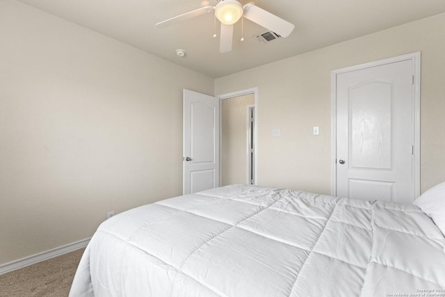 bedroom with a ceiling fan, carpet flooring, visible vents, and baseboards