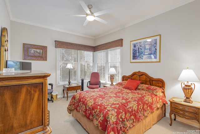 bedroom with light carpet, ceiling fan, baseboards, and crown molding