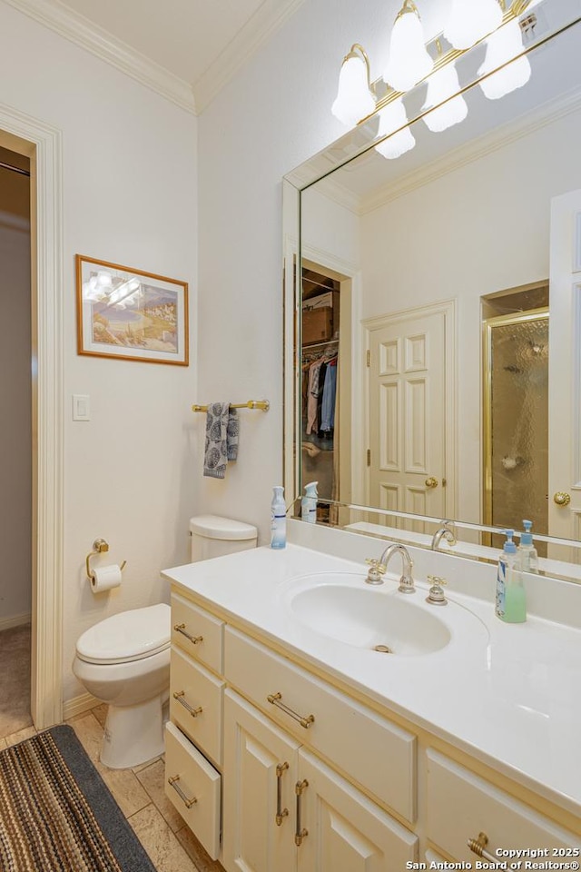 bathroom with toilet, vanity, a spacious closet, a shower stall, and crown molding