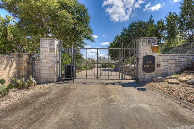 view of gate with fence