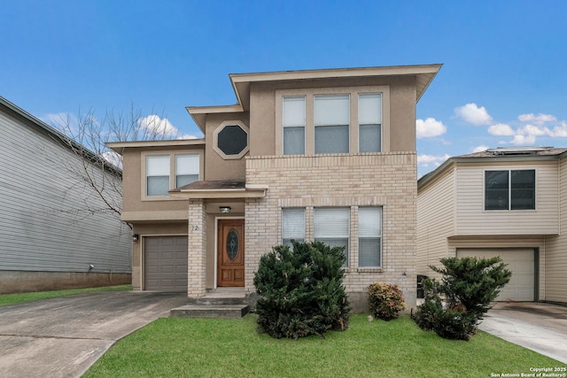 view of front of property with concrete driveway, brick siding, an attached garage, and stucco siding