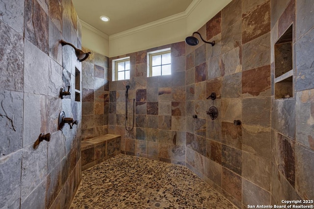 full bath featuring tiled shower and crown molding