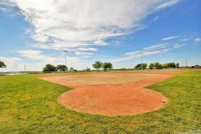 view of community featuring a rural view and a lawn