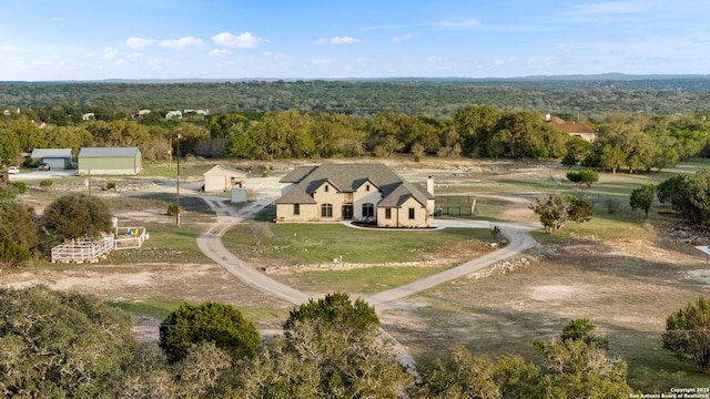 drone / aerial view featuring a forest view and a rural view