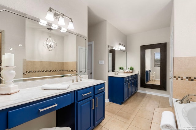 full bathroom with a bath, two vanities, a sink, and tile patterned floors