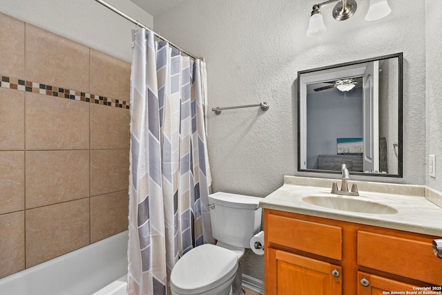 bathroom featuring toilet, shower / bathtub combination with curtain, vanity, and a textured wall