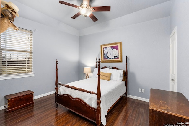 bedroom featuring wood finished floors, a ceiling fan, and baseboards