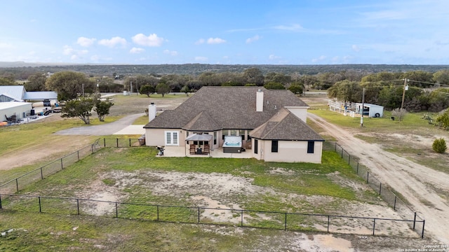 birds eye view of property with a rural view