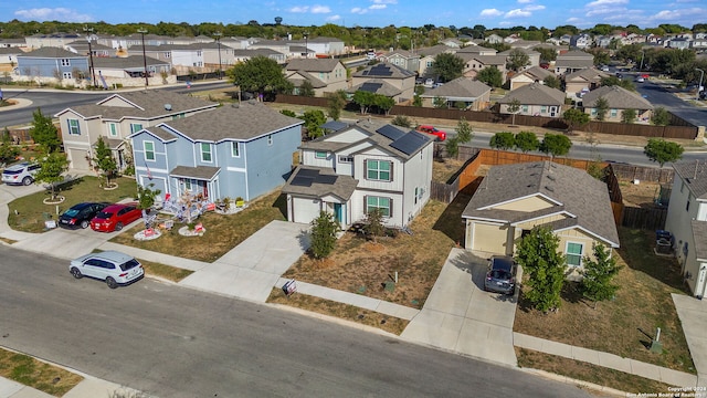 birds eye view of property with a residential view