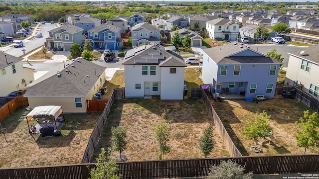 birds eye view of property with a residential view