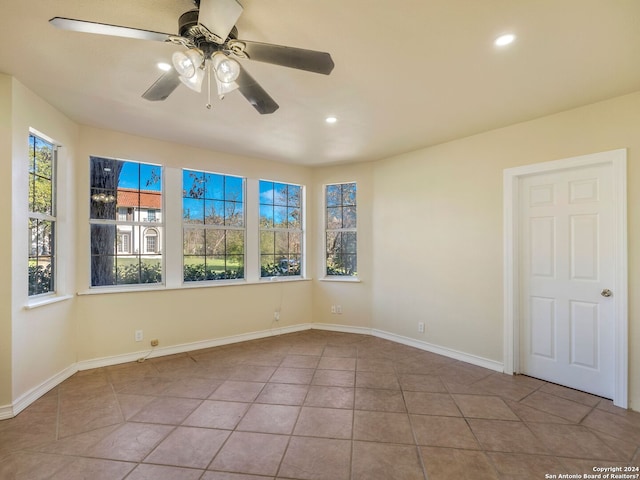 unfurnished room with a ceiling fan, recessed lighting, baseboards, and tile patterned floors