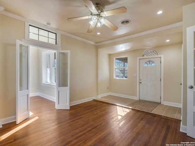 foyer with baseboards, visible vents, ornamental molding, wood finished floors, and recessed lighting