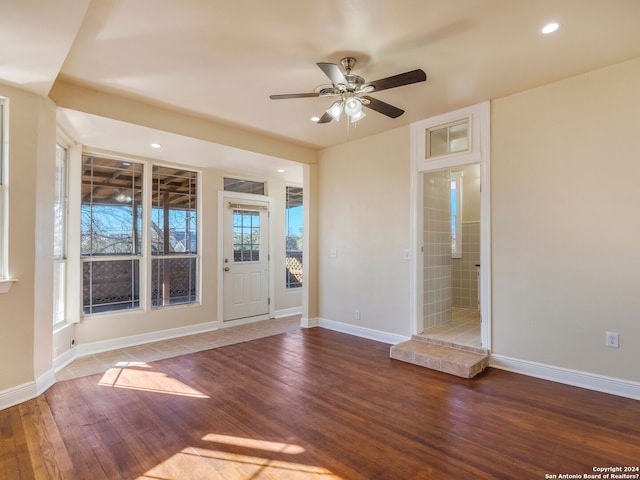 spare room with hardwood / wood-style flooring, ceiling fan, baseboards, and recessed lighting