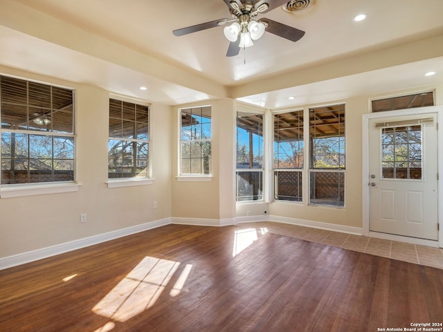 interior space featuring visible vents, baseboards, wood finished floors, and recessed lighting