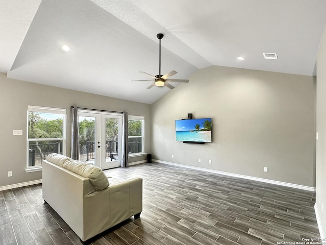 living room featuring baseboards, visible vents, french doors, lofted ceiling, and wood finish floors