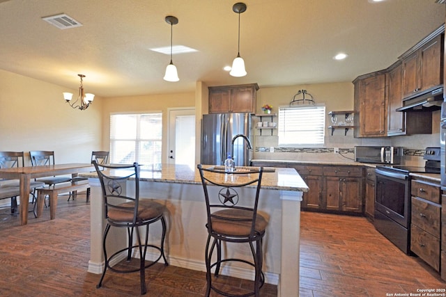 kitchen featuring visible vents, dark wood-style floors, stainless steel appliances, under cabinet range hood, and open shelves