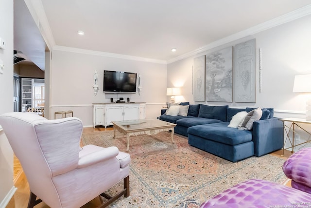 living area with light wood finished floors, ornamental molding, and recessed lighting