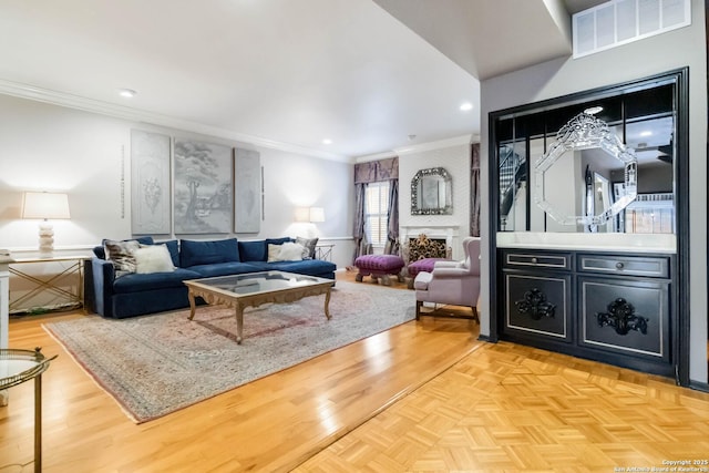 living area featuring parquet floors, crown molding, recessed lighting, visible vents, and a large fireplace