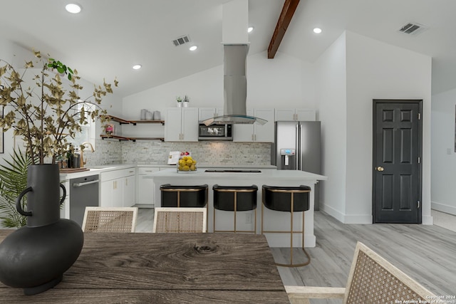 kitchen with stainless steel appliances, light countertops, visible vents, and white cabinetry