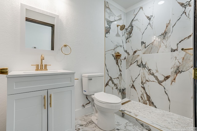 bathroom with toilet, marble finish floor, a marble finish shower, and vanity