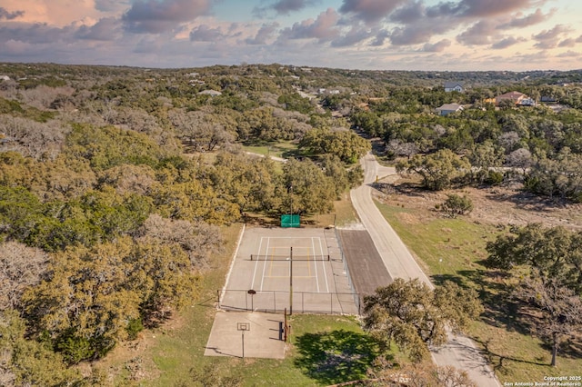 bird's eye view featuring a wooded view